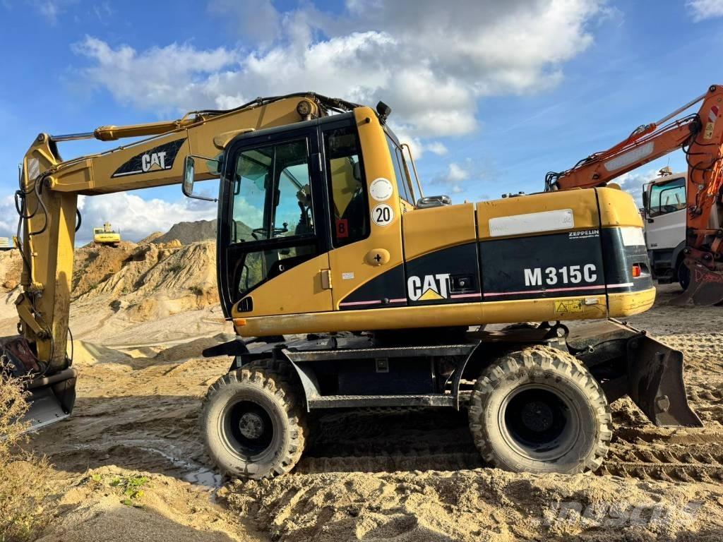 CAT M 315 C حفارات بعجل