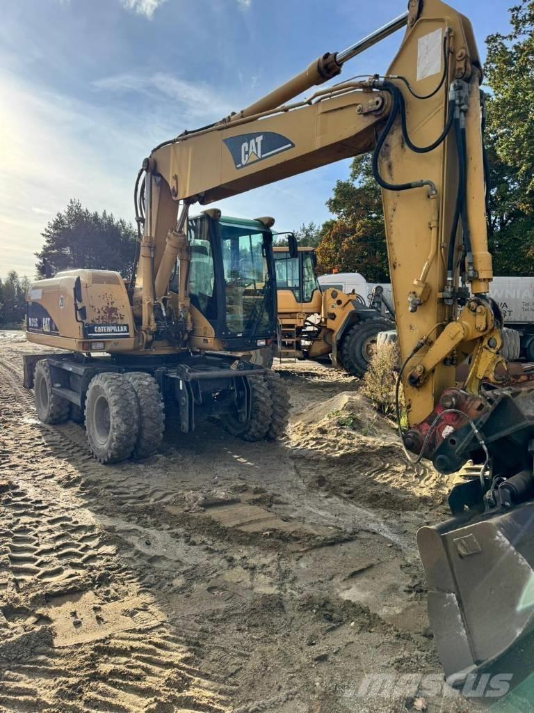 CAT M 315 C حفارات بعجل