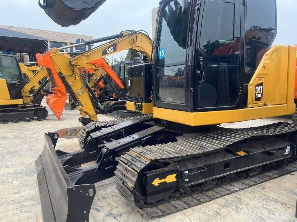 CAT 310 حفارات زحافة