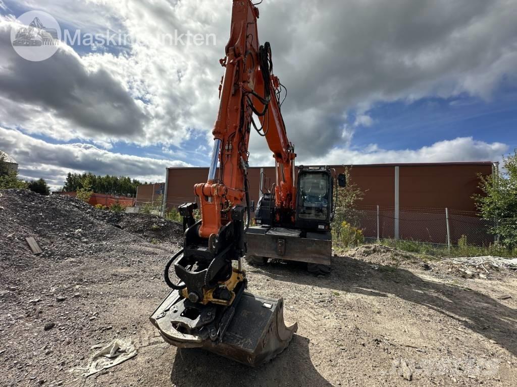 Hitachi ZX 140 W-5B حفارات بعجل