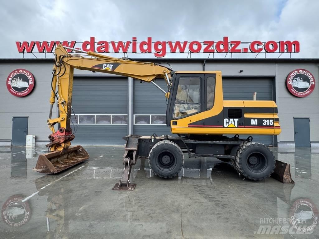 CAT M 315 حفارات بعجل