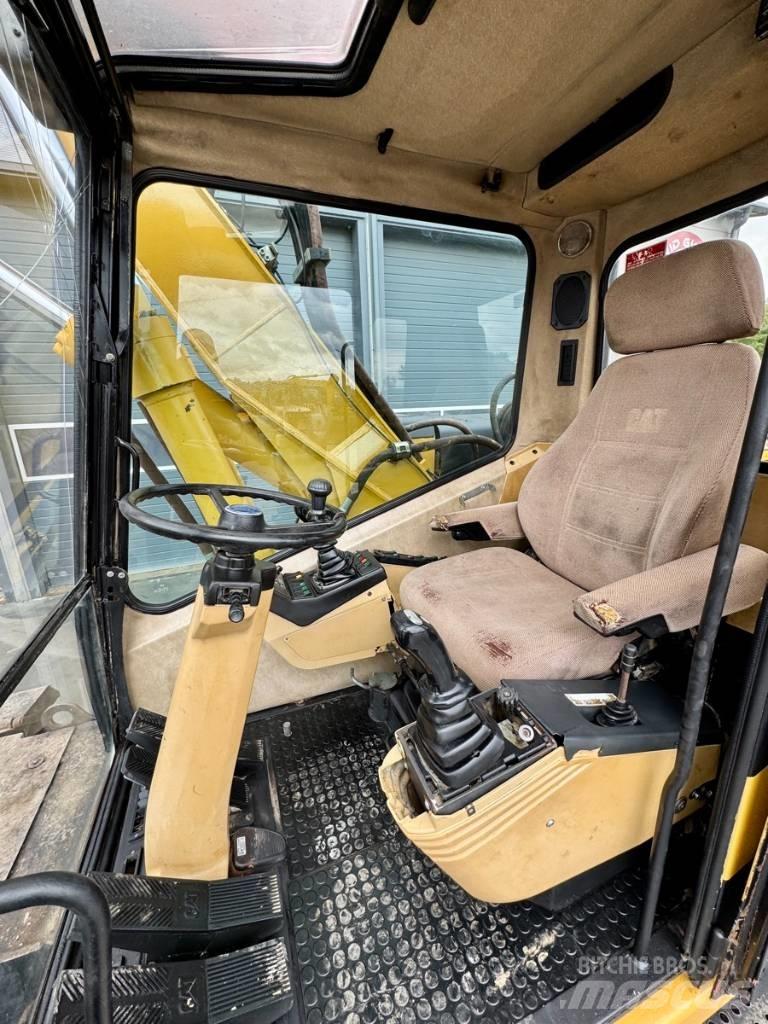 CAT M 315 حفارات بعجل