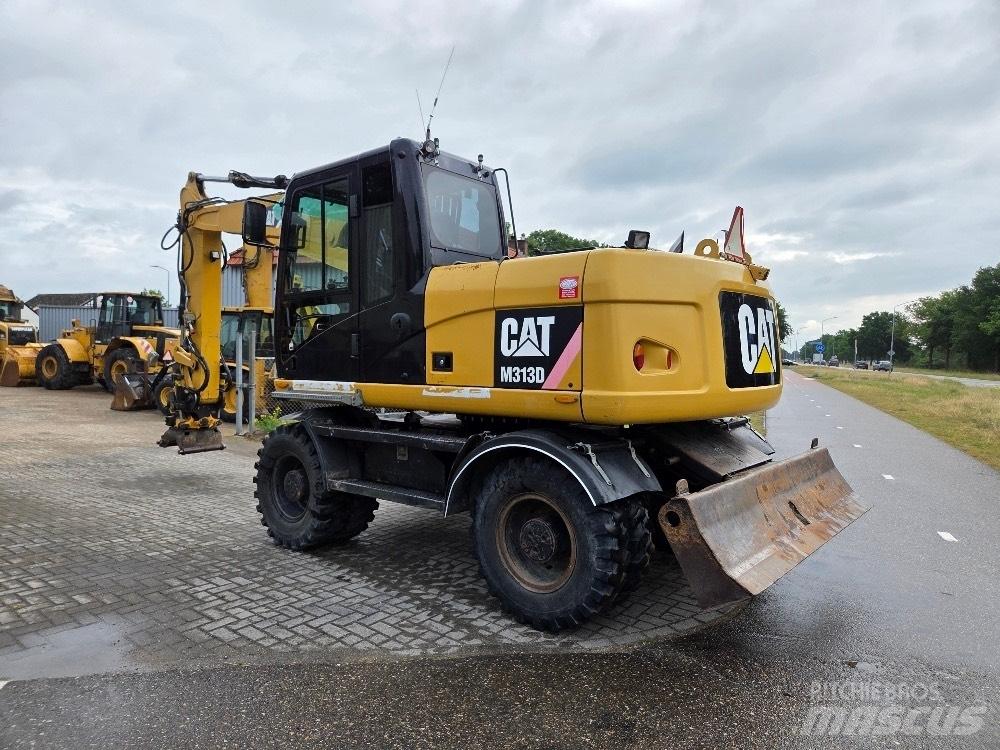 CAT M313D حفارات بعجل