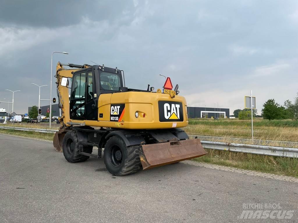 CAT M313D حفارات بعجل