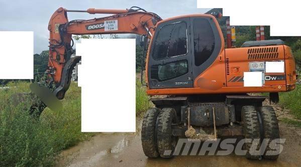 Doosan DX 140 W حفارات بعجل