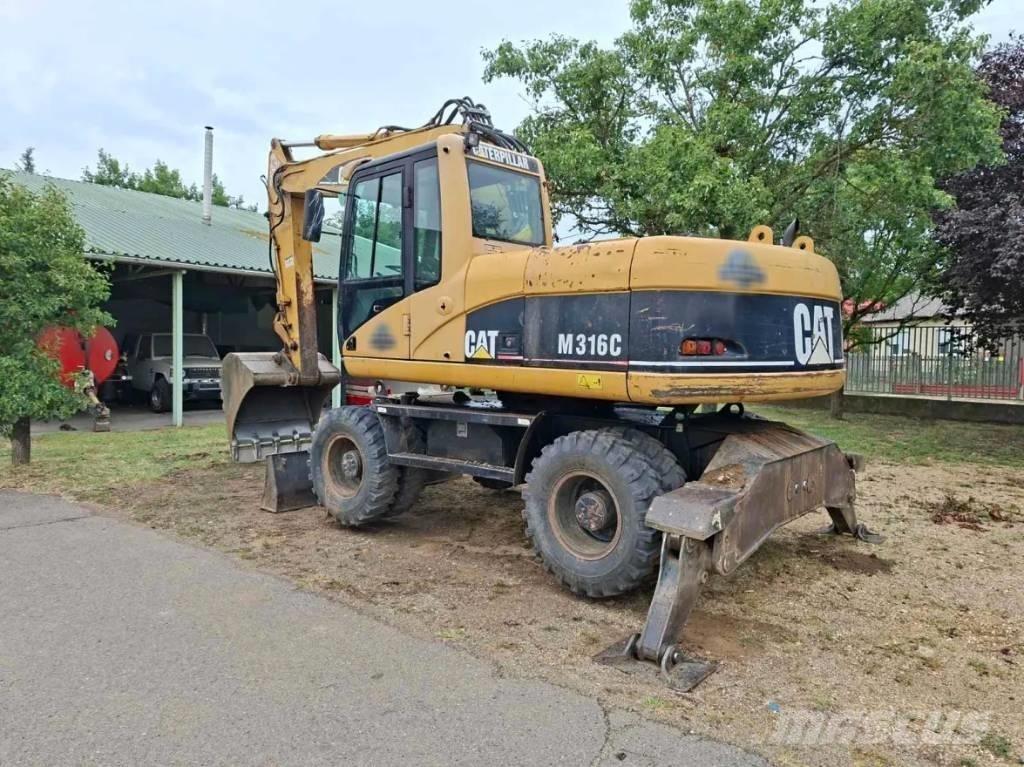 CAT M 316 C حفارات بعجل