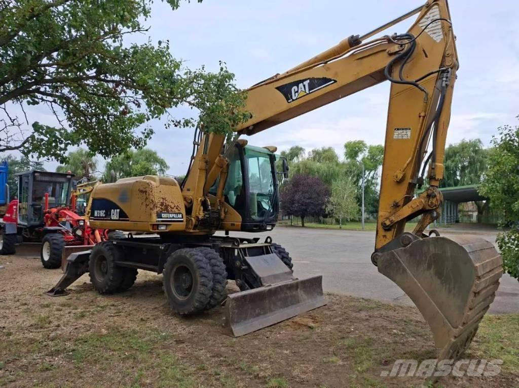 CAT M 316 C حفارات بعجل
