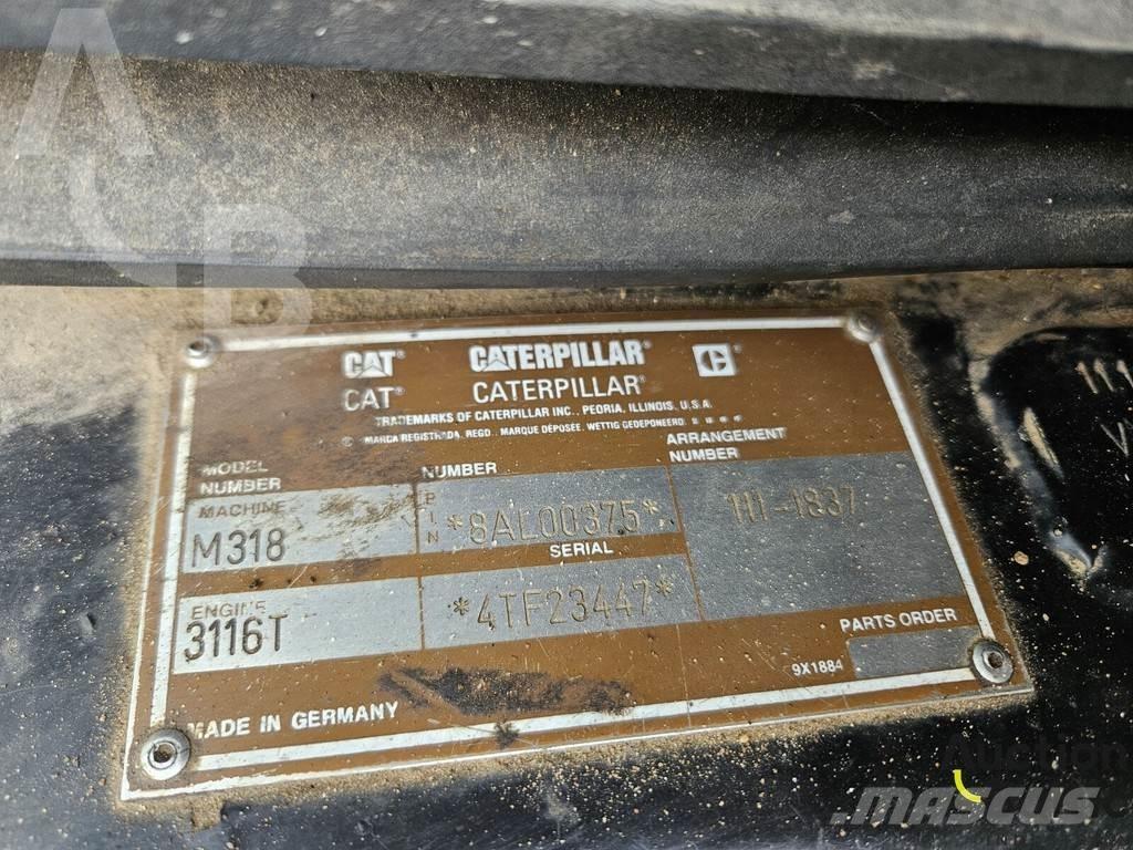 CAT M 318 C حفارات بعجل