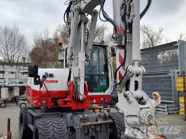 Takeuchi TB 395 W حفارات بعجل