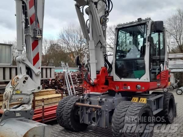 Takeuchi TB 395 W حفارات بعجل