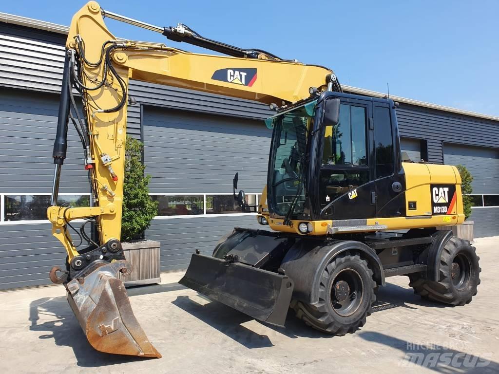 CAT M 313 D حفارات بعجل