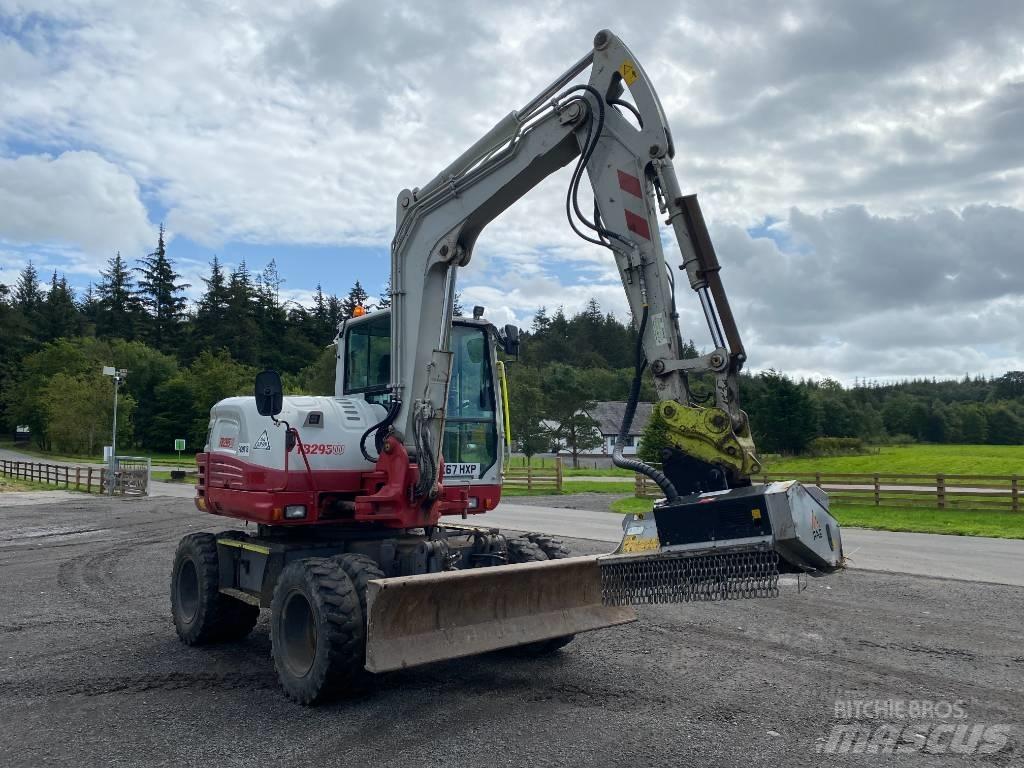 Takeuchi TB 295 W حفارات بعجل