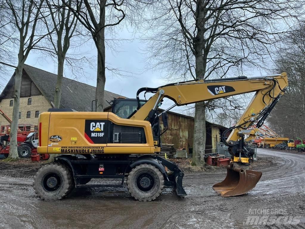 CAT M 318 F حفارات بعجل
