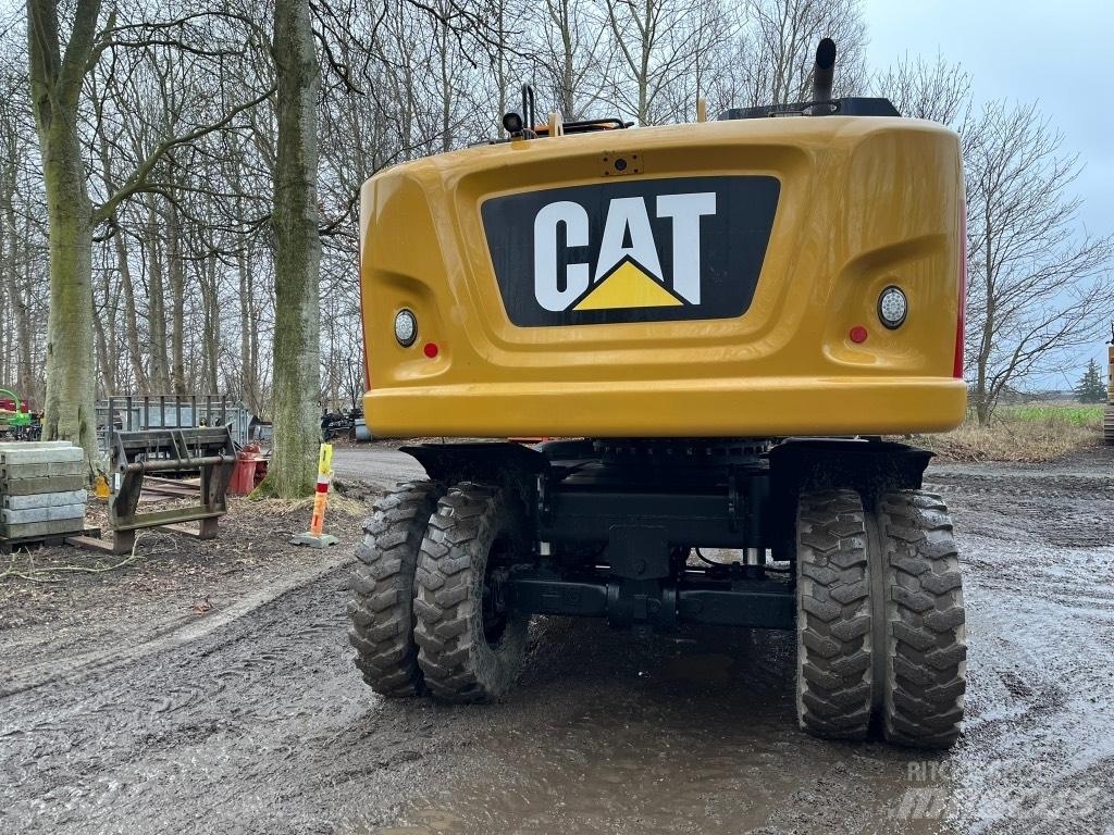 CAT M 318 F حفارات بعجل