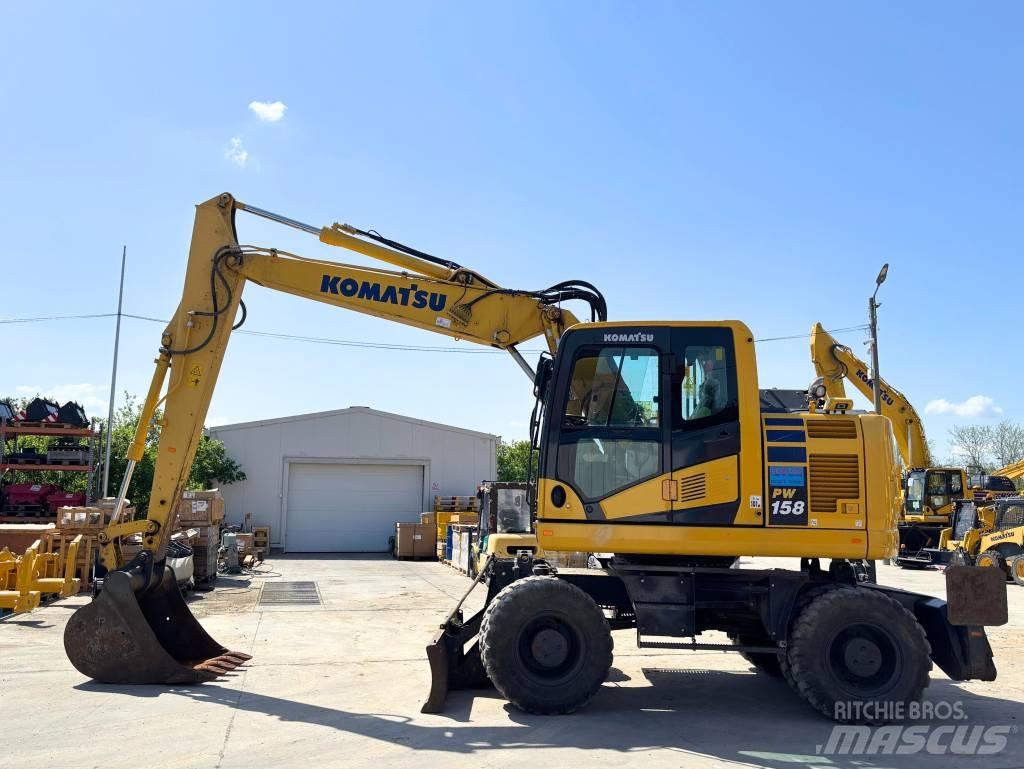 Komatsu PW 158-11 حفارات بعجل