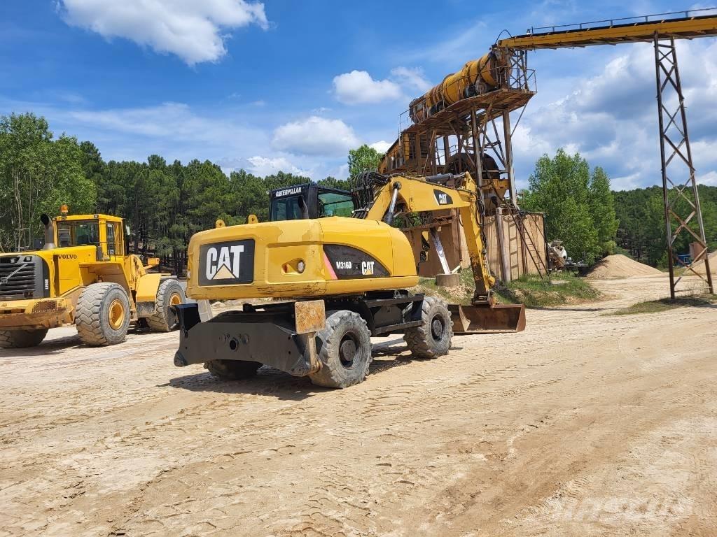 CAT M318d حفارات بعجل