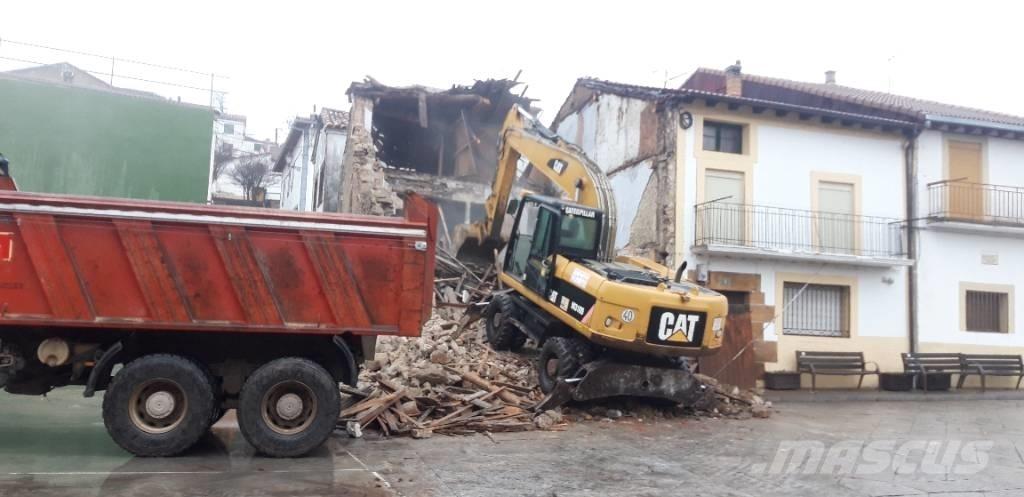 CAT M318d حفارات بعجل