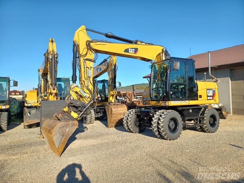 CAT M 313 D حفارات بعجل