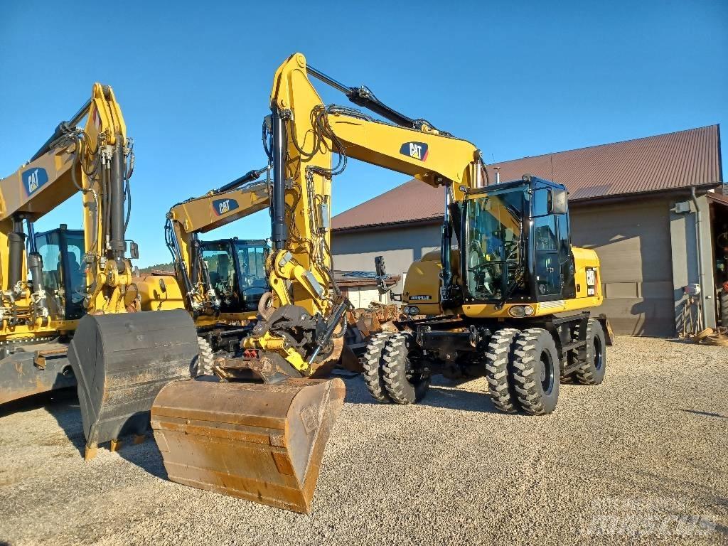 CAT M 313 D حفارات بعجل