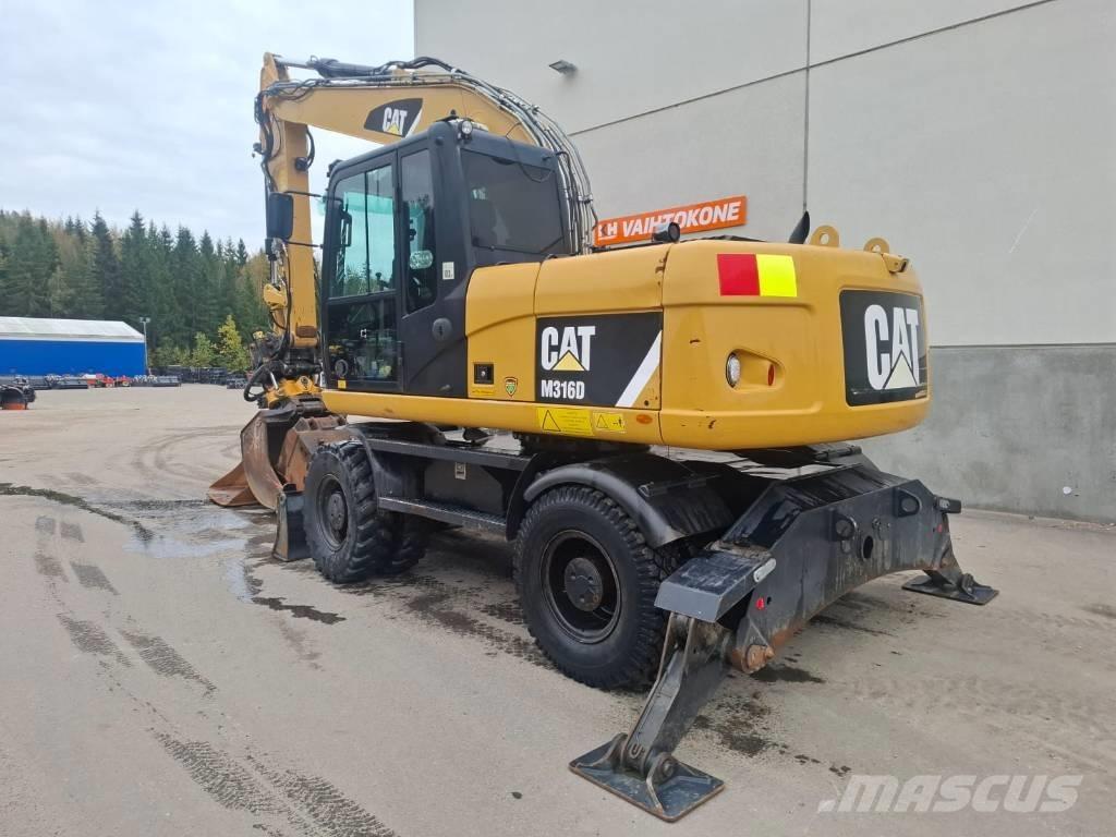 CAT M 316 D حفارات بعجل