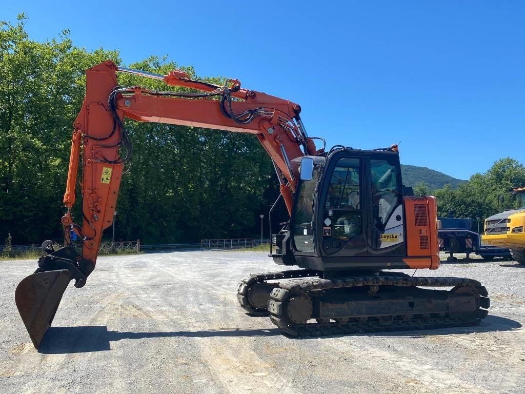 Hitachi ZX 135 US-6 حفارات زحافة