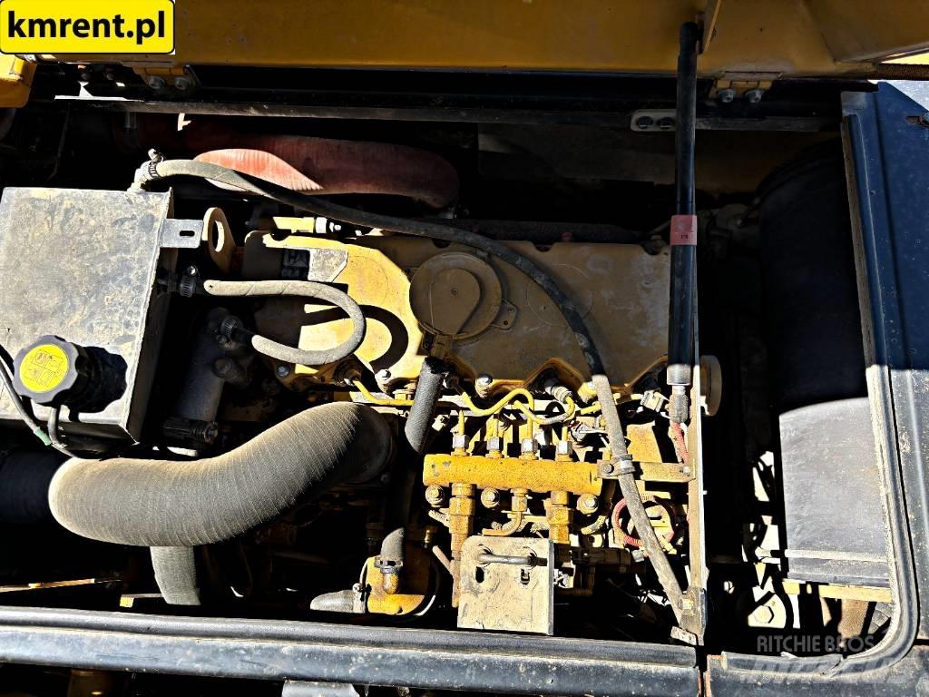 CAT M 313 D حفارات بعجل