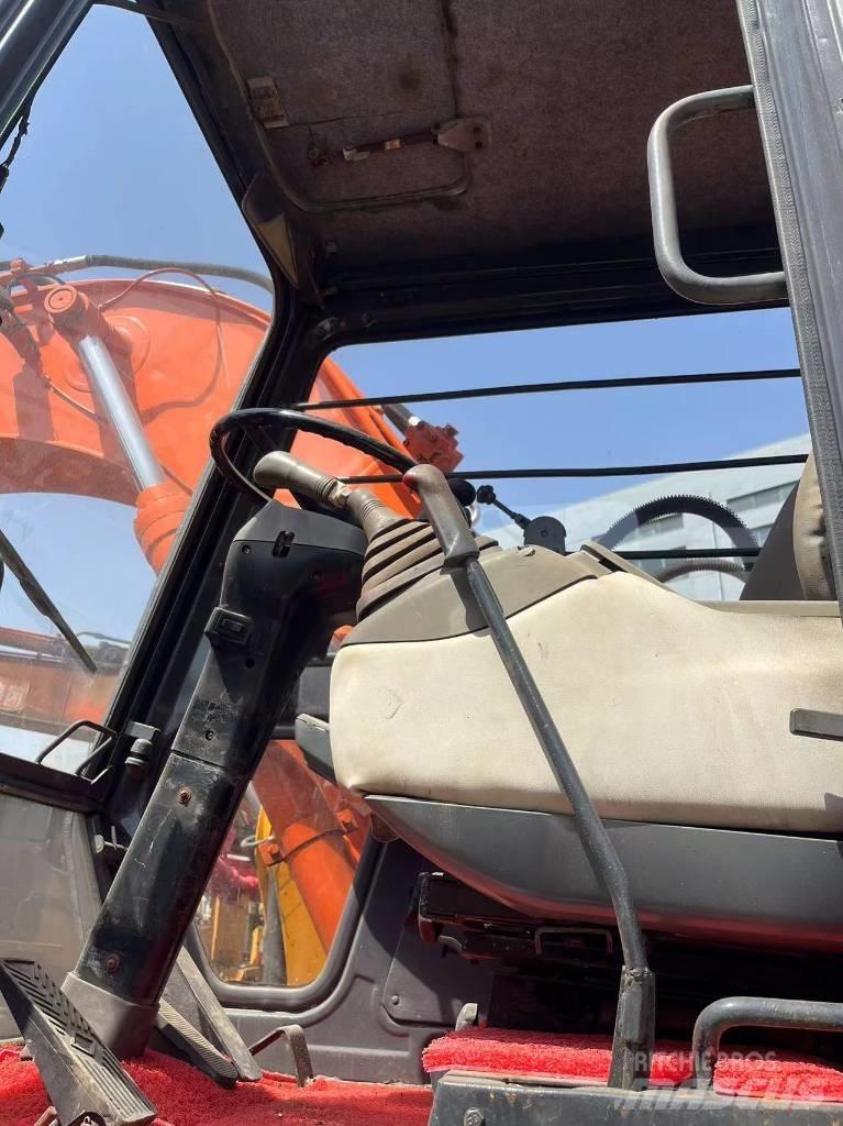 Hitachi EX 100 W D حفارات بعجل