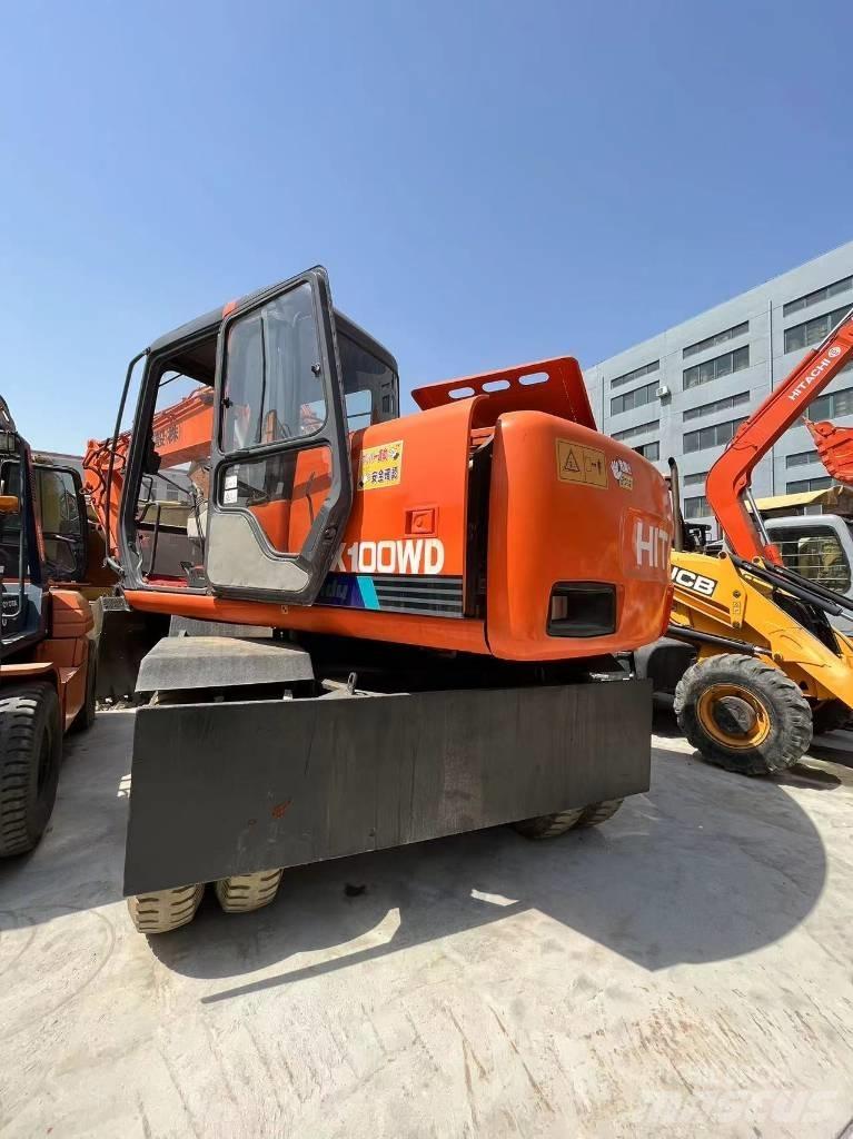 Hitachi EX 100 W D حفارات بعجل