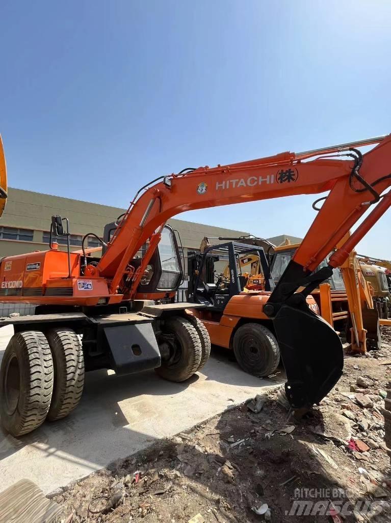 Hitachi EX 100 W D حفارات بعجل