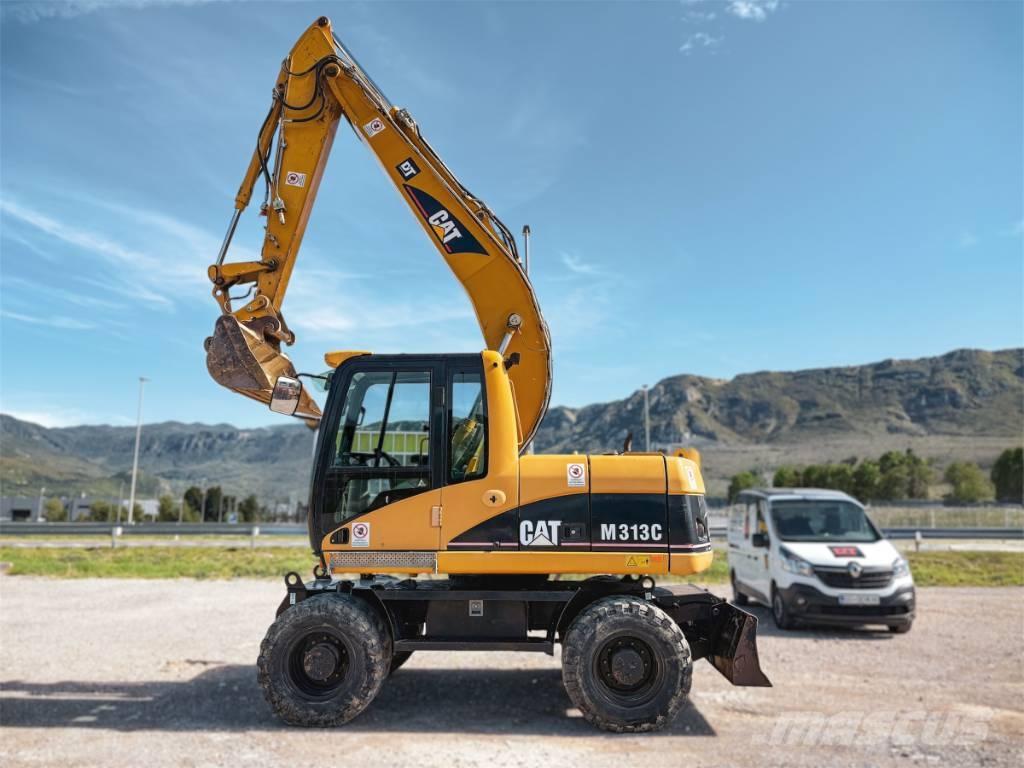CAT M 313 C حفارات بعجل