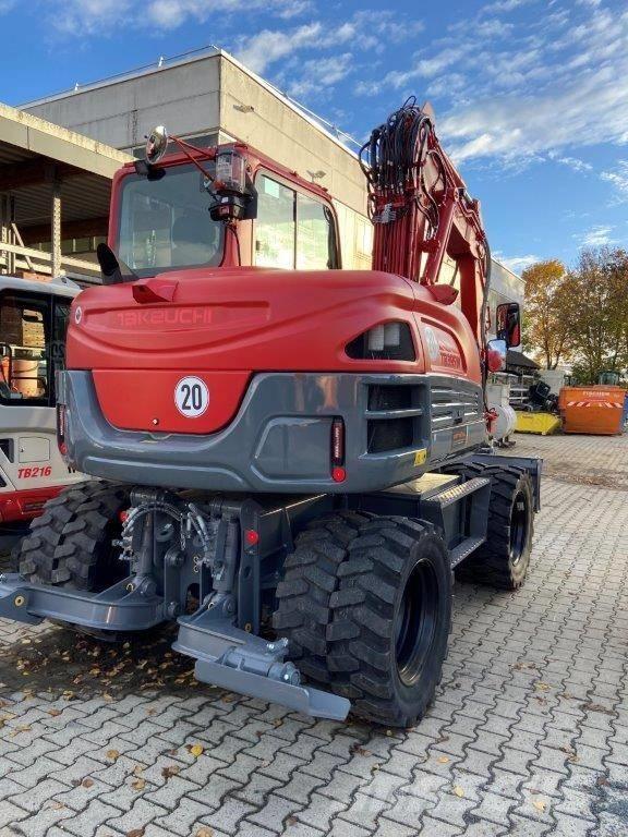 Takeuchi TB 395 W حفارات بعجل