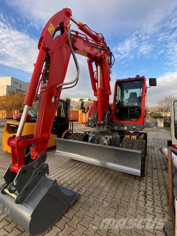 Takeuchi TB 395 W حفارات بعجل