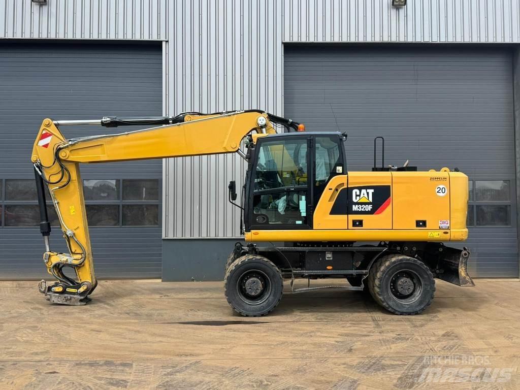 CAT M320F حفارات بعجل