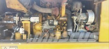 CAT M 313 D حفارات بعجل