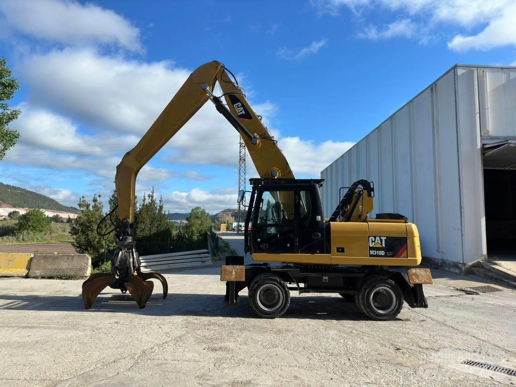 CAT M 318 MH حفارات بعجل