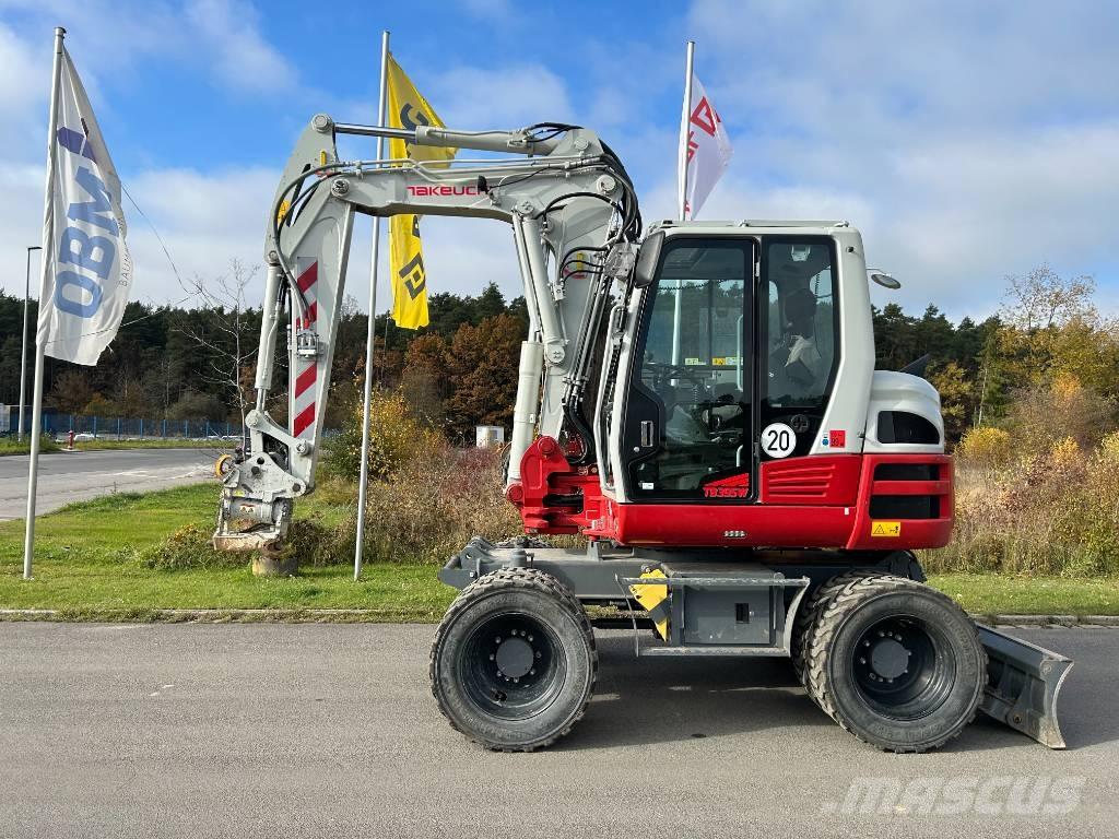 Takeuchi TB 395 W حفارات بعجل