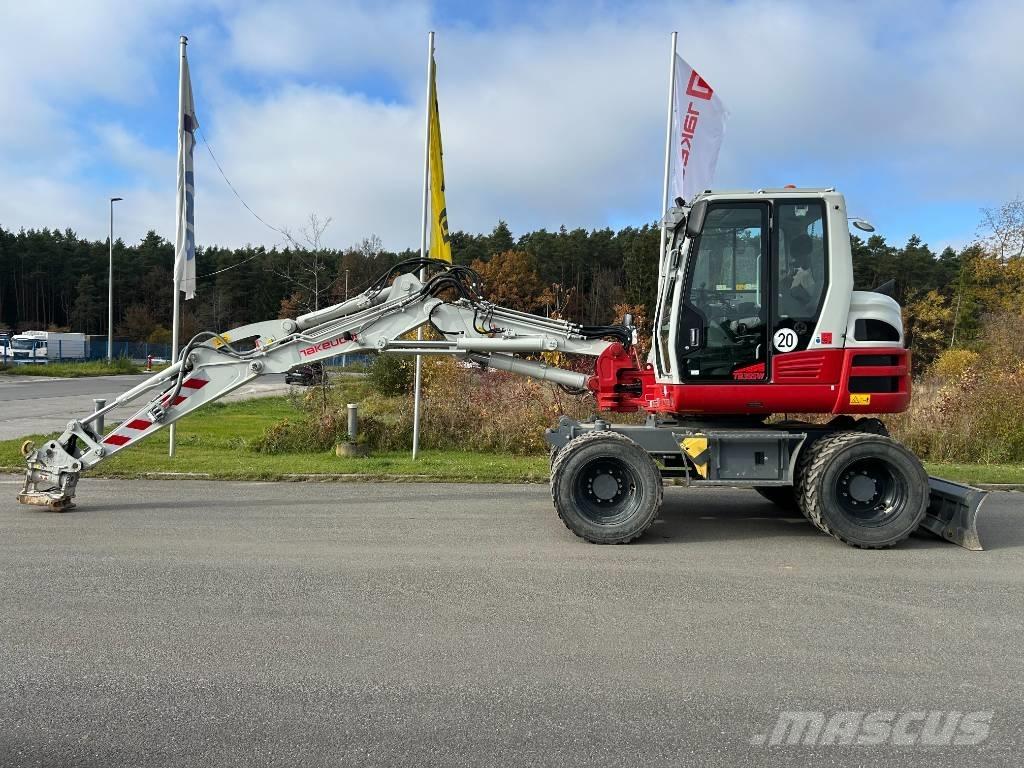 Takeuchi TB 395 W حفارات بعجل