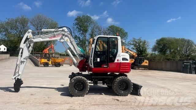 Takeuchi TB295W حفارات بعجل