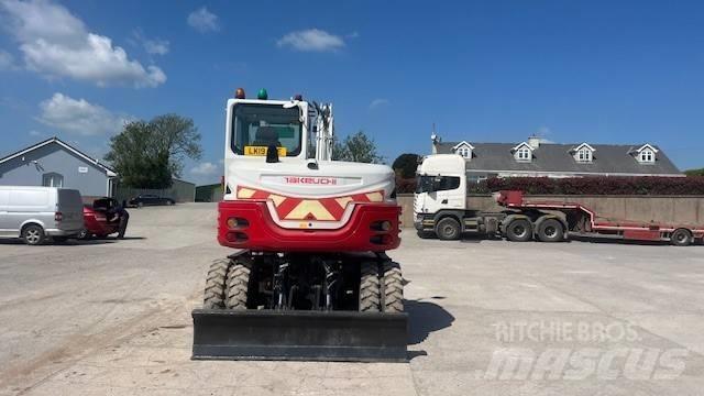 Takeuchi TB295W حفارات بعجل