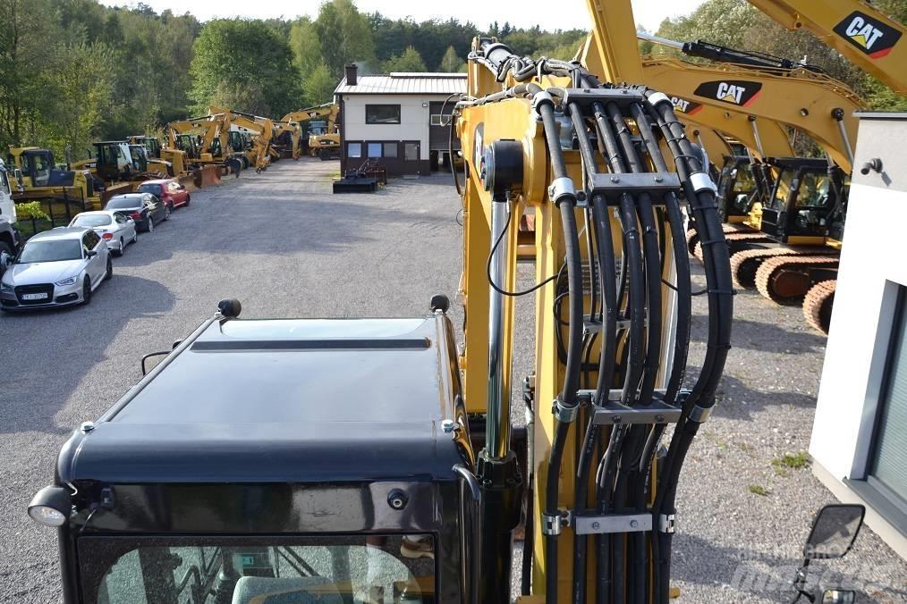 CAT M 315 D حفارات بعجل