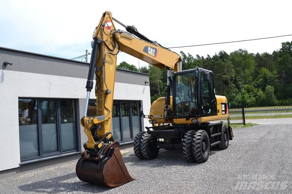 CAT M 315 D حفارات بعجل