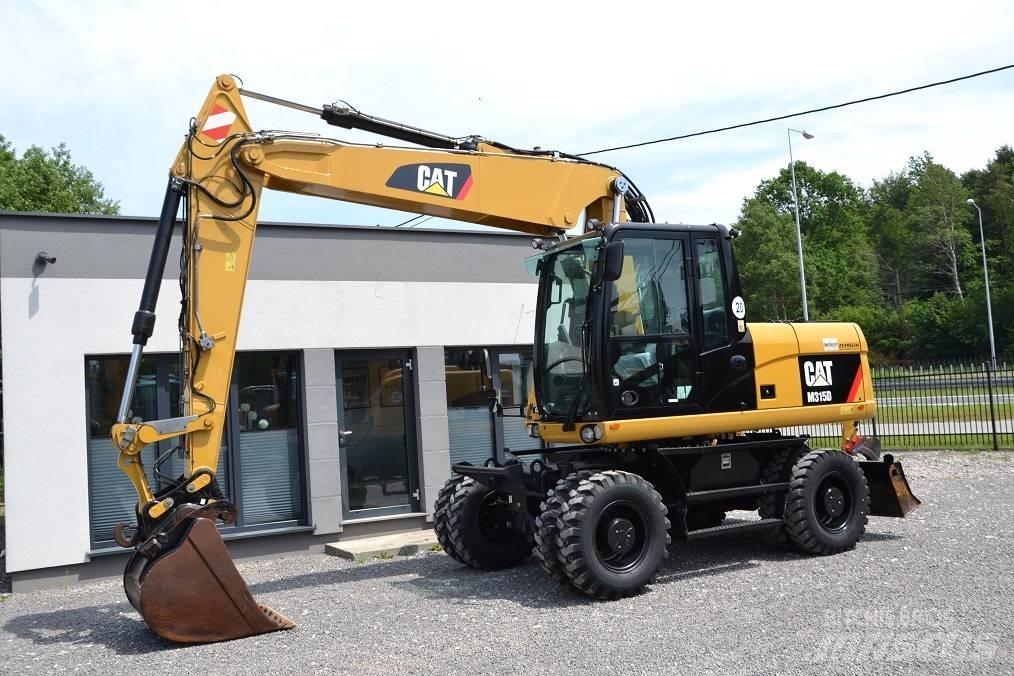 CAT M 315 D حفارات بعجل