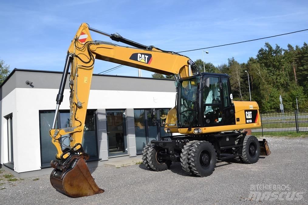 CAT M 315 D حفارات بعجل