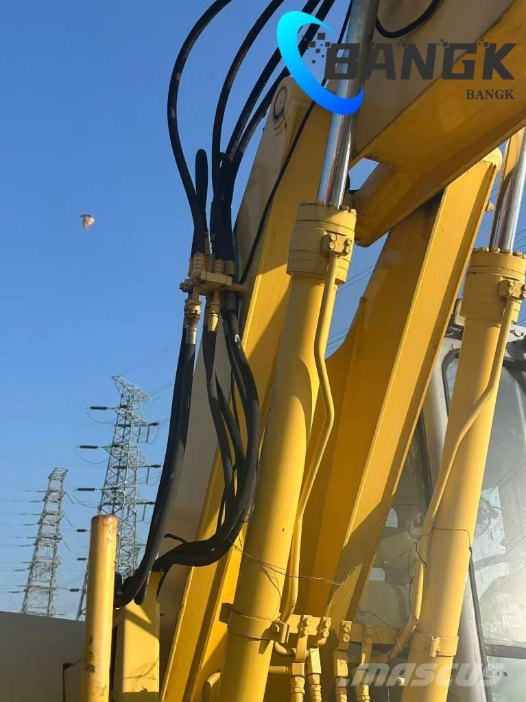  KOMΛ1'SU PW128us حفارات بعجل