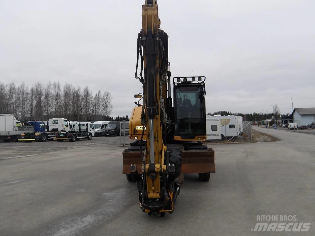 CAT M 318 حفارات بعجل
