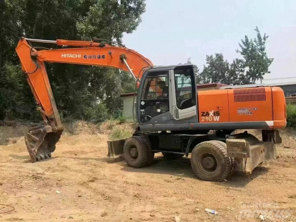 Hitachi 210w حفارات بعجل