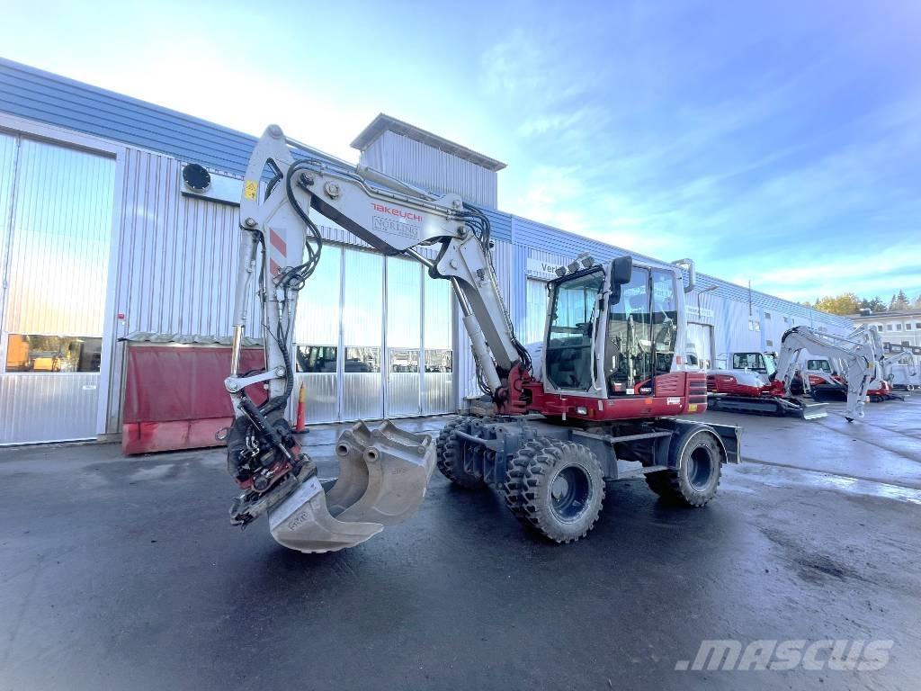 Takeuchi TB 295 W حفارات بعجل