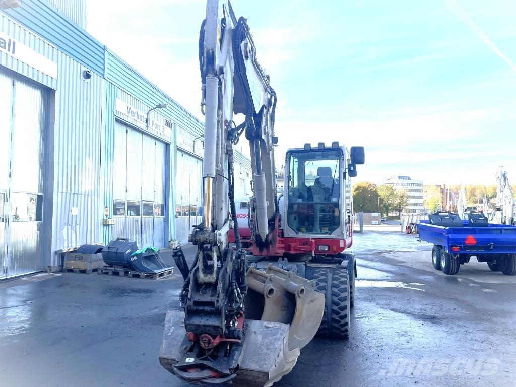 Takeuchi TB 295 W حفارات بعجل