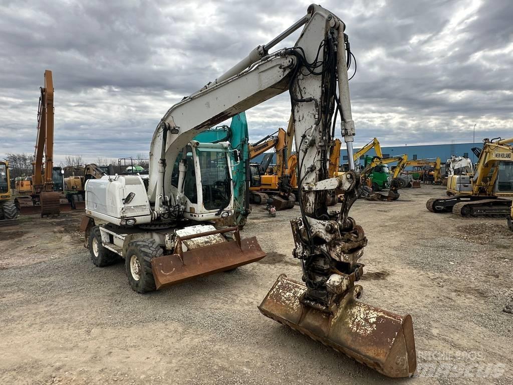 CAT M 316 D حفارات بعجل
