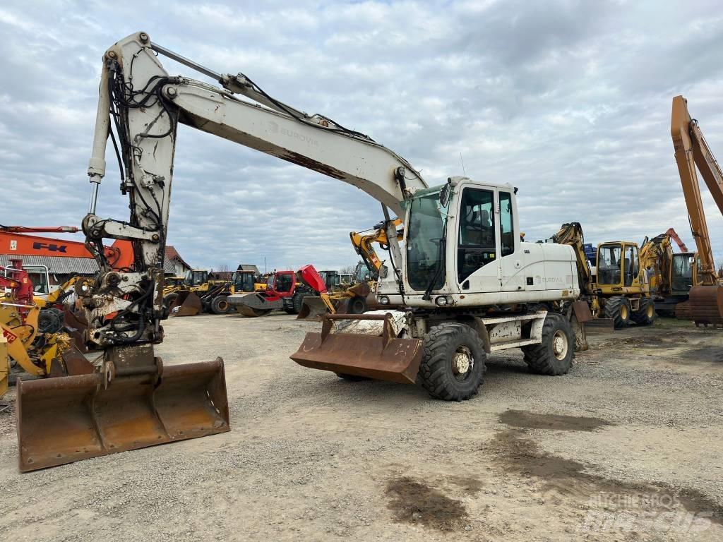 CAT M 316 D حفارات بعجل